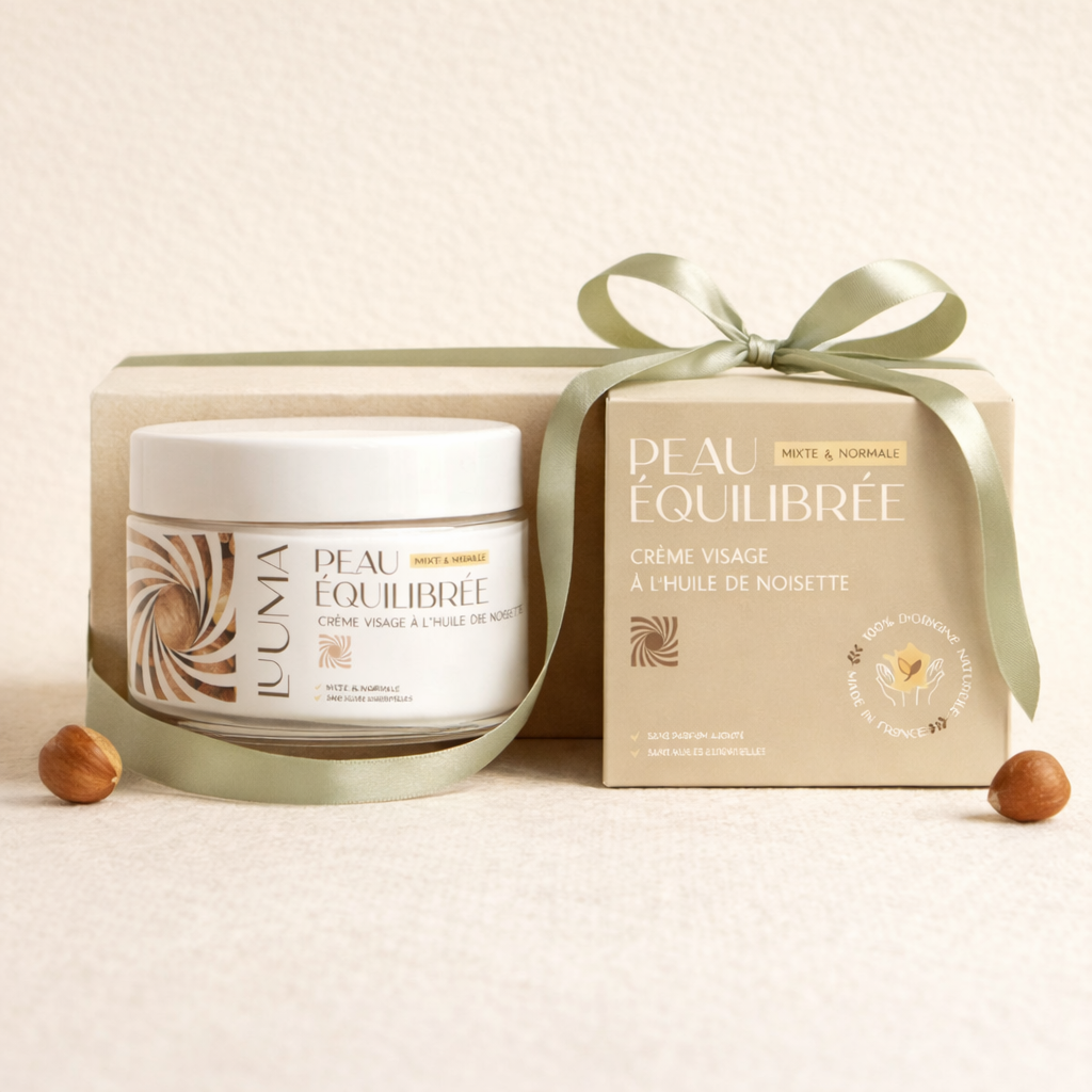 La creme et sa boite sont entourés d'un ruban cadeau